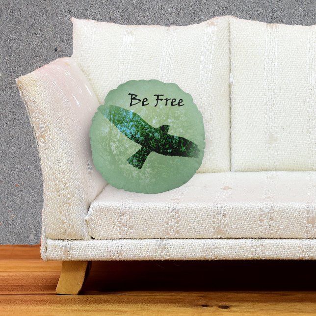 Nature Green Trees Bird Soaring Crow Be Free Round Pillow (Transparent silhouette flying black crow treetops on green decorative pillow.)