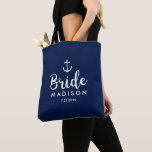 Nautical Wedding White Anchor Personalized Bride Tote Bag<br><div class="desc">Surprise the Bride with this personalized tote bag featuring a nautical design with a white anchor set against a navy background. Customize by adding her name and wedding date. A great size for wedding essentials: extra clothing, shoes, snacks, water, etc. The perfect go-to bag for a nautical, beach or destination...</div>
