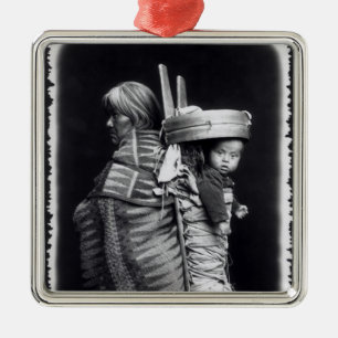 Navaho woman carrying a papoose on her back metal ornament