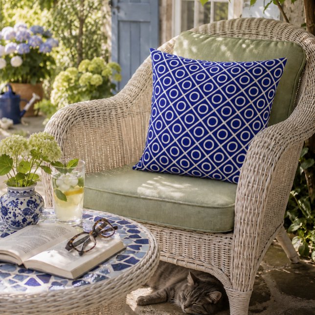 Navy and White Circles Throw Pillow (Bold blue geometry brings timeless style to a peaceful garden retreat.)
