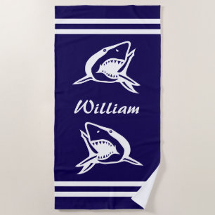 Navy blue and white beach towel with shark logo