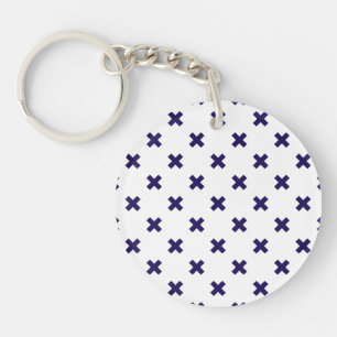 Navy blue cross stitches on white keychain