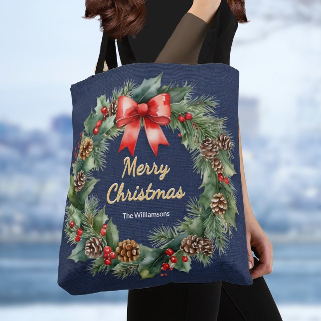 Navy Blue Festive Christmas Wreath Elegant Custom Tote Bag (A stylish personalized Christmas tote bag with festive wreath of holly, pinecones and red ribbon)