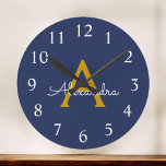 Navy Blue Gold Modern Script Girly Monogram Name Large Clock<br><div class="desc">Navy Blue and Gold Simple Script Monogram Name Clock. This makes the perfect sweet 16 birthday,  wedding,  bridal shower,  anniversary,  baby shower or bachelorette party gift for someone that loves glam luxury and chic styles.</div>