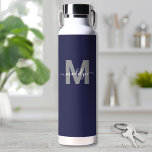 Navy Blue Name Monogram Water Bottle<br><div class="desc">Create Your Own Personalized Navy Blue Initial Script Name Monogram Water Bottle. This stylish and modern water bottle features a deep navy blue background for a sleek and versatile look. A soft grey initial sits in the centre with a clean, flat finish, while a white flowing script name overlays the...</div>