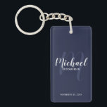 Navy Modern Script Personalized Groomsmen Keychain<br><div class="desc">Add a personal touch to your wedding with personalized groomsmen keychain. This keychain features personalized groomsmen's name in white modern script font style and monogram in light navy blue modern script font style as background with title and wedding date in white modern sans serif font style on navy blue background....</div>