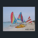 Negril, Jamaica Postcard<br><div class="desc">Postcard featuring a photograph taken along Negril's 7 mile beach in Jamaica showcasing the sand,  sea and sky as well as the boats on the beach. Makes a good gift for any yardie.</div>