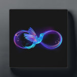 Neon Infinity Symbol with Glowing Hummingbird Plaque<br><div class="desc">Glowing,  purple infinity symbol with flying,  luminous,  blue hummingbird on black background. Neon.</div>