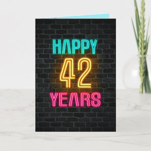 Neon sign on brick for 42nd birthday card