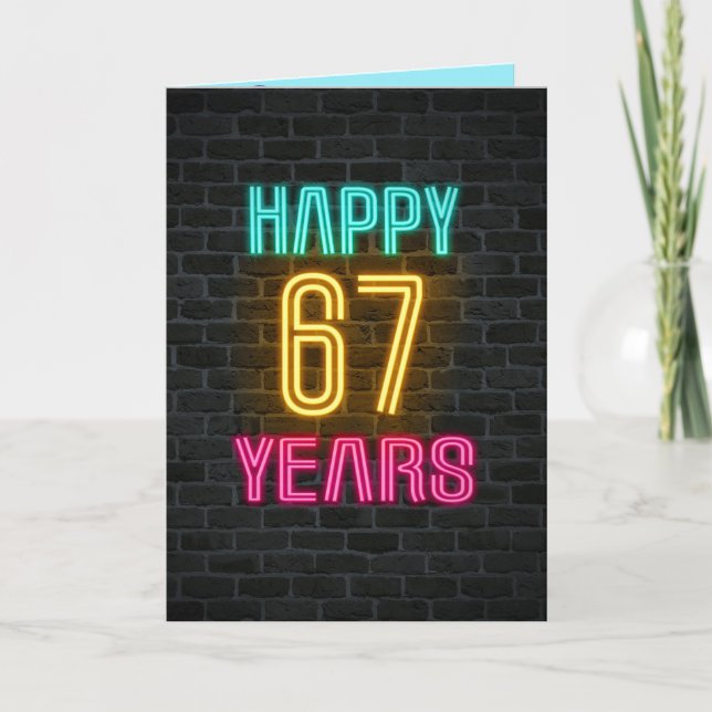 Neon sign on brick for 67th birthday card (Front)