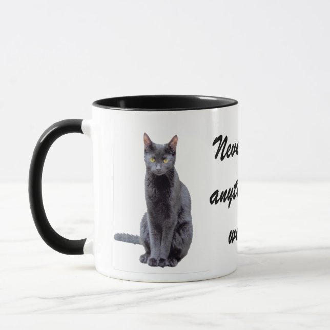 Never feed your cat... mug (Left)