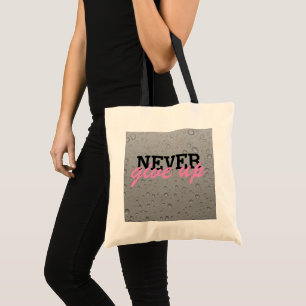 Never give up tote bag