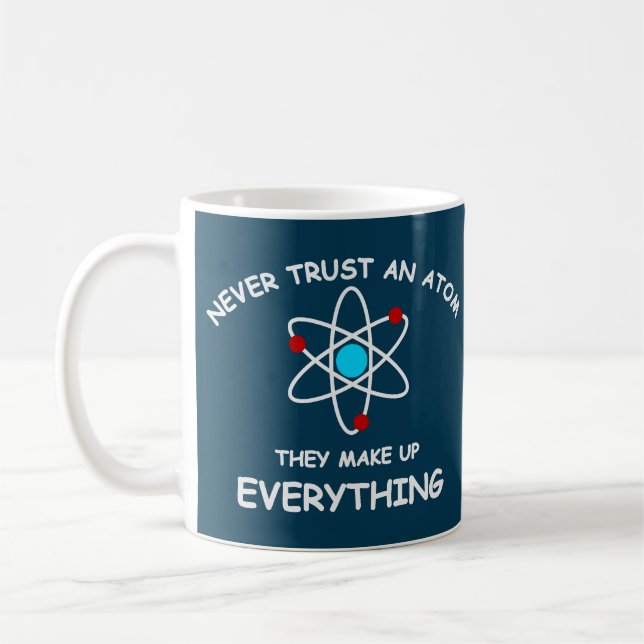 Never trust an atom, they make up everything coffee mug (Left)