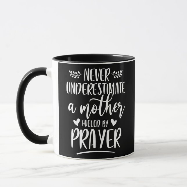 Never Underestimate A Mother Fueled By Prayer Mug (Left)