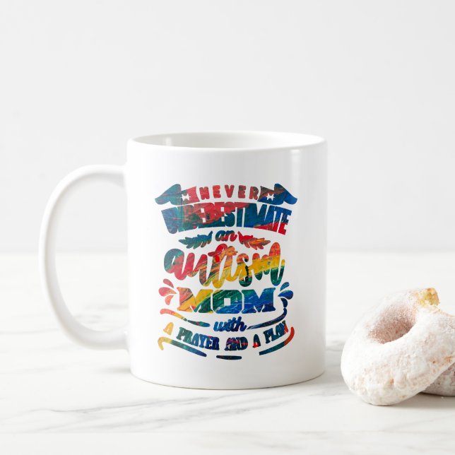 Never Underestimate an Autism Mom Rainbow Coffee Mug (With Donut)