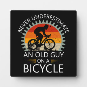 Never Underestimate An Old Guy On A Bicycle Plaque