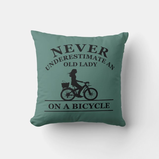 Never underestimate an old lady on a bicycle  throw pillow (Front)