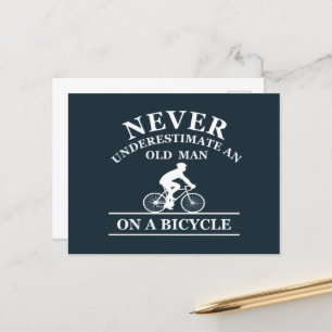 never underestimate an old man on a bicycle holiday postcard