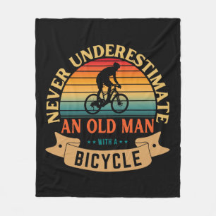 Never underestimate an old man with a bicycle fleece blanket