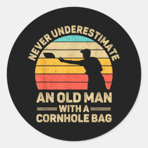 Never Underestimate An Old Man With a Cornhole Bag Classic Round Sticker