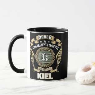 NEVER_UNDERESTIMATE_POWER_OF_A_KIEL MUG