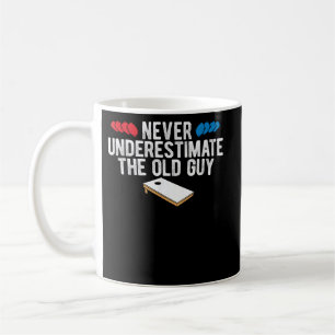 Never Underestimate The Old Guy Cornhole Coffee Mug