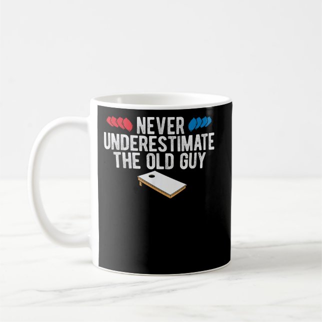 Never Underestimate The Old Guy Cornhole Coffee Mug (Left)