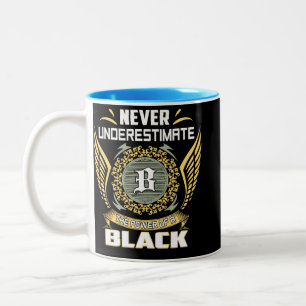 Never Underestimate The Power Of A Black Two-Tone Coffee Mug