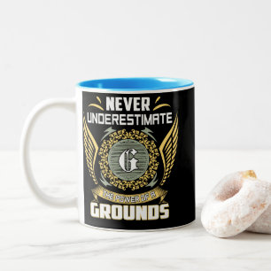 Never Underestimate The Power Of A Grounds Two-Tone Coffee Mug