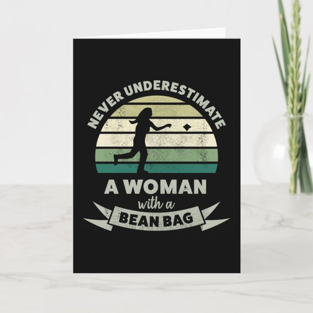 Never underestimate Woman with Bean Bag Cornhole Card (Front)