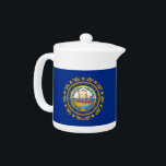 New Hampshire State Flag Teapot<br><div class="desc">Serve Your Tea with Granite State Pride Using Our Teapot Featuring the Flag of New Hampshire! Add a distinctive touch to your tea time with our elegantly designed teapot adorned with the flag of New Hampshire. Ideal for both everyday use and special occasions, this teapot combines functionality with a celebration...</div>