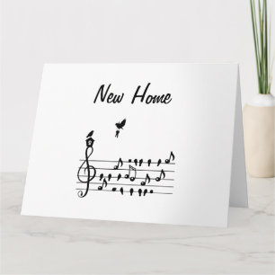 New home, song bird carrying key of new home       card