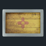 New Mexico State Flag on Old Wood Grain Belt Buckle<br><div class="desc">New Mexico State Flag on Old Wood Grain Feel free to modify the design according to your own preferences. You may change the design location, orientation, background colours and size. Also, you may add your own text, or slogan set its font, location and size, all in order to create the...</div>