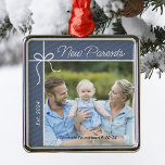 New Parents Family First Christmas Photo Metal Ornament<br><div class="desc">Celebrate your first year as parents with a heartfelt keepsake ornament! Personalize this charming Christmas tree decoration with a treasured photo of your new family, along with your baby's name and birth date. It's a beautiful way to capture this special milestone and create lasting memories for years to come. Perfect...</div>