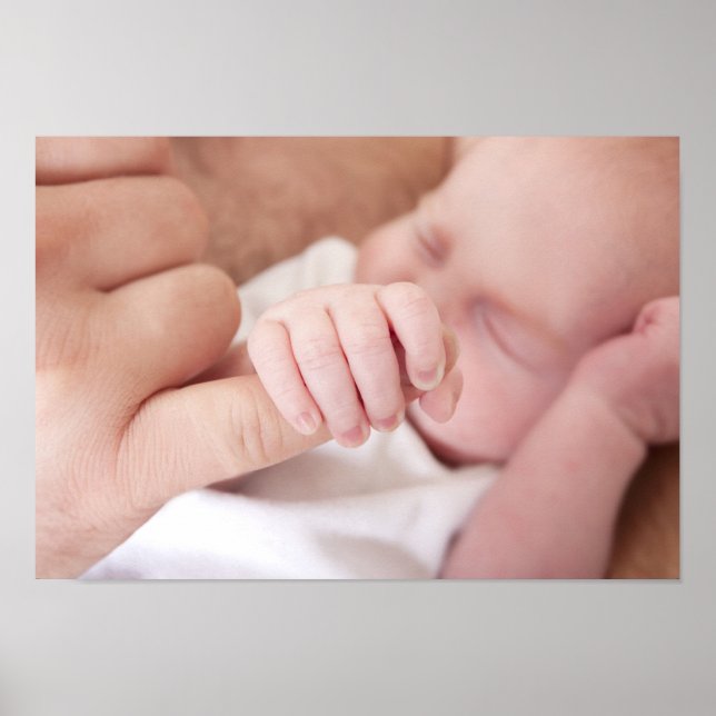 newborn baby holding fathers finger poster (Front)
