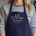 Newlywed Bride Personalized Blue Apron<br><div class="desc">For the bride and groom, this navy blue apron features "Mrs." in a modern script font along with a last name and established date. This is a perfect bridal shower or wedding gift. These Mrs. and Mr. aprons are available in a variety of colours and can be also customized to...</div>