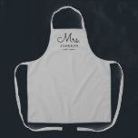 Newlywed Bride Personalized Grey Apron<br><div class="desc">For the bride and groom, this grey apron features "Mrs." in a modern script font along with a last name and established date. This is a perfect bridal shower or wedding gift. These Mrs. and Mr. aprons are available in a variety of colours and can be also customized to match...</div>