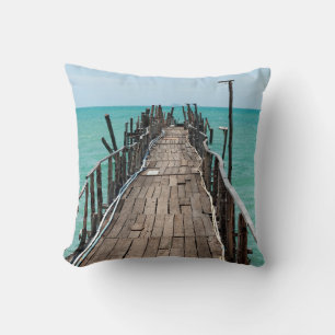 Nice wooden bridge with blue sea background at Sam Throw Pillow