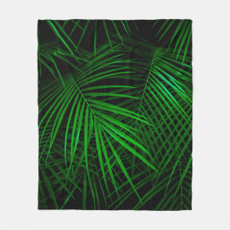 Night in tropical rainforest. Palm leaves lit with Fleece Blanket