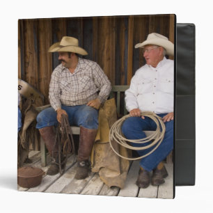 North America, USA. Cowboys relaxing and Binder