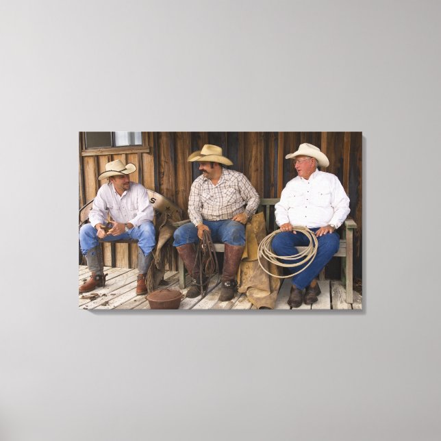 North America, USA. Cowboys relaxing and Canvas Print (Front)