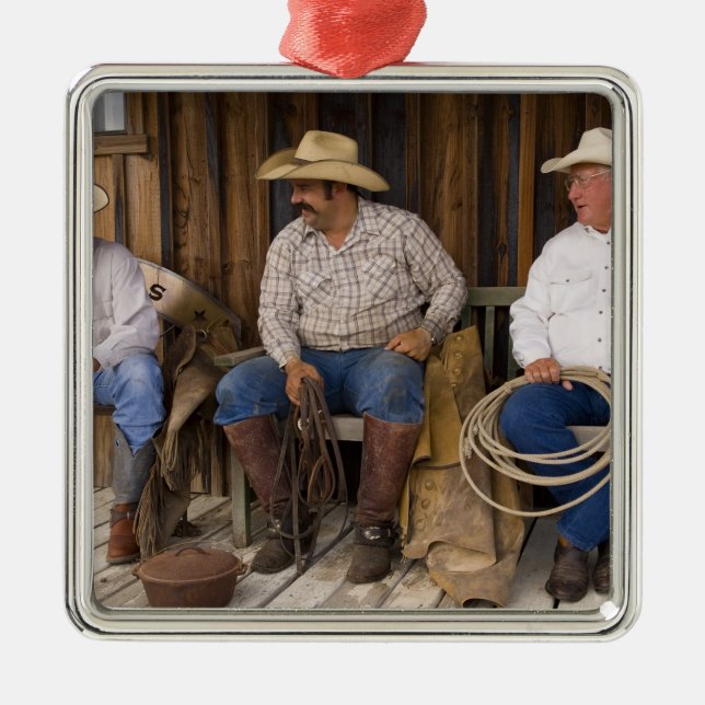 North America, USA. Cowboys relaxing and Metal Ornament (Front)