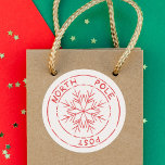 North Pole Post Stamp Snowflake Christmas  Classic Round Sticker<br><div class="desc">This North Pole post stamp Christmas classic round sticker is a cute addition to your gift giving this year. Add a sprinkle of North Pole magic to your Christmas gifts with our festive North Pole Post sticker, turning every present into a delightfully wrapped package from Santa himself. See the whole...</div>