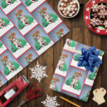 North Pole Snowman Dragon Penguin Christmas Wrapping Paper<br><div class="desc">Step into a magical winter wonderland with this charming holiday illustration! Featuring a cheerful snowman and an adorable penguin holding festive Christmas gifts, this scene is made even more enchanting by a watchful green dragon resting protectively around them. A candy cane signpost pointing to the North Pole and softly falling...</div>