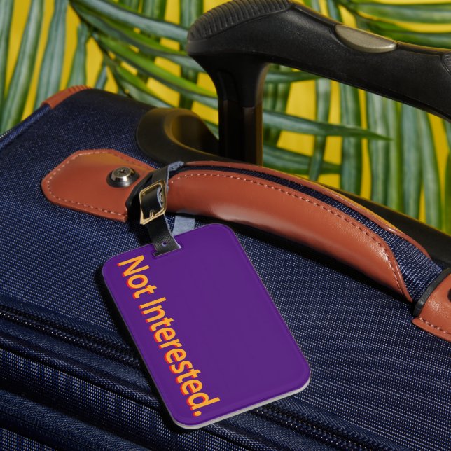 Not Interested. Orange Text Luggage Tag (Front Insitu 1)
