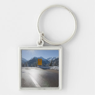 notice board on a winter road, snow covered 2 keychain
