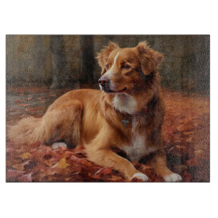 Nova Scotia Duck Terrier In Autumn Leaves Fall  Cutting Board