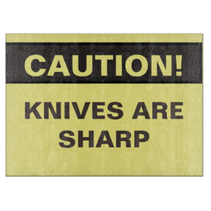 Novelty Caution. Knives are sharp. Cutting Board