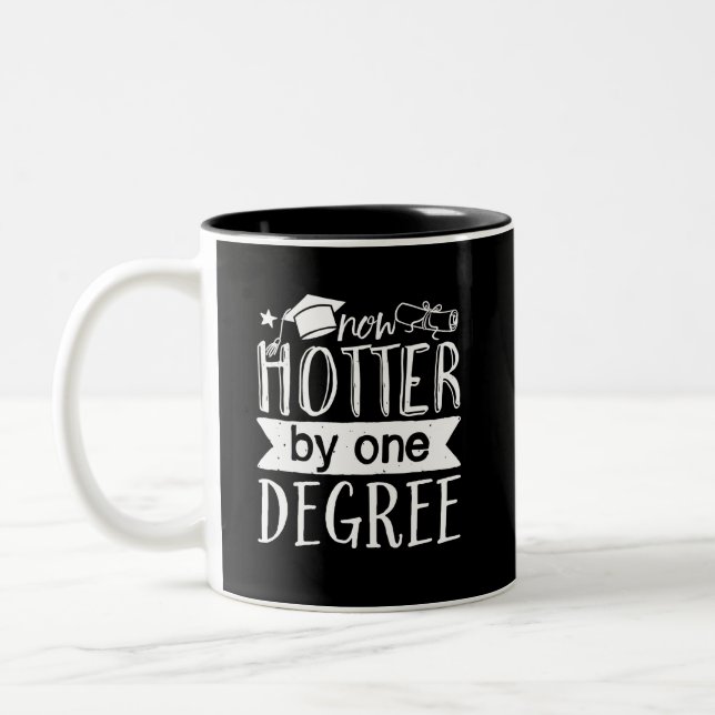 Now Hotter by 1 Degree Funny Graduation Day Puns Two-Tone Coffee Mug (Left)