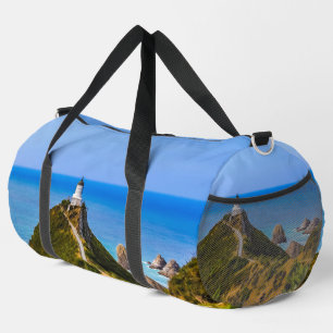 Nugget Point lighthouse, New Zealand Duffle Bag